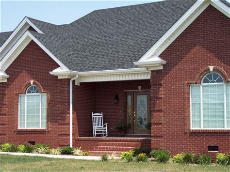 red brick house with grey metal roof|red brick house roof colours.